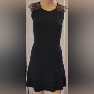 Elegant Black Lace-Shoulder Dress by Zara.